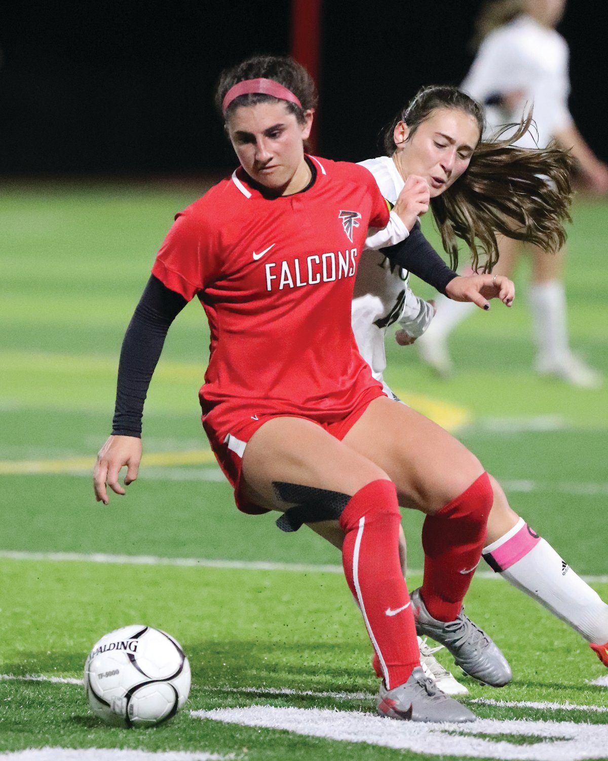 FIGHTING FOR THE BALL: Maddie Alves battles for the ball.